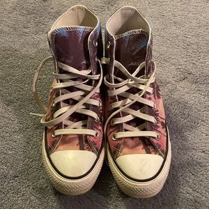 Converse that has palm trees over an ombré sunset color
